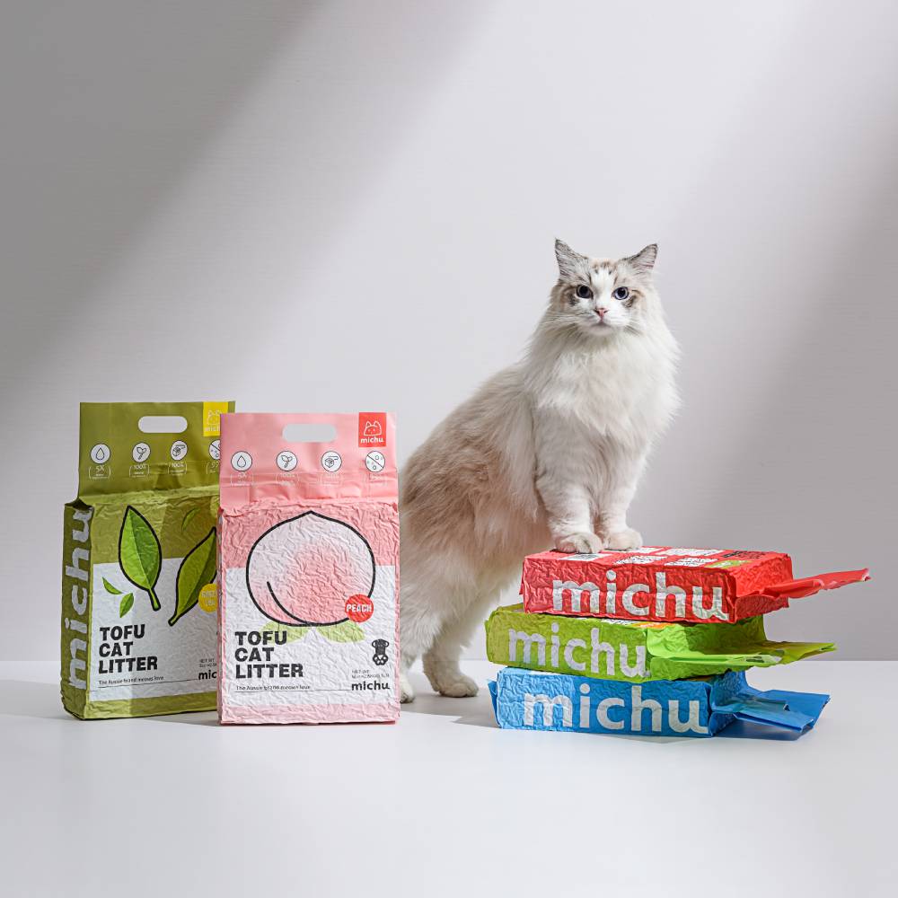 Cat with Michu tofu cat litter in multiple scents including green tea and peach